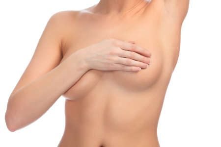 Cropped image of a female controlling breast for cancer, isolated on white background
